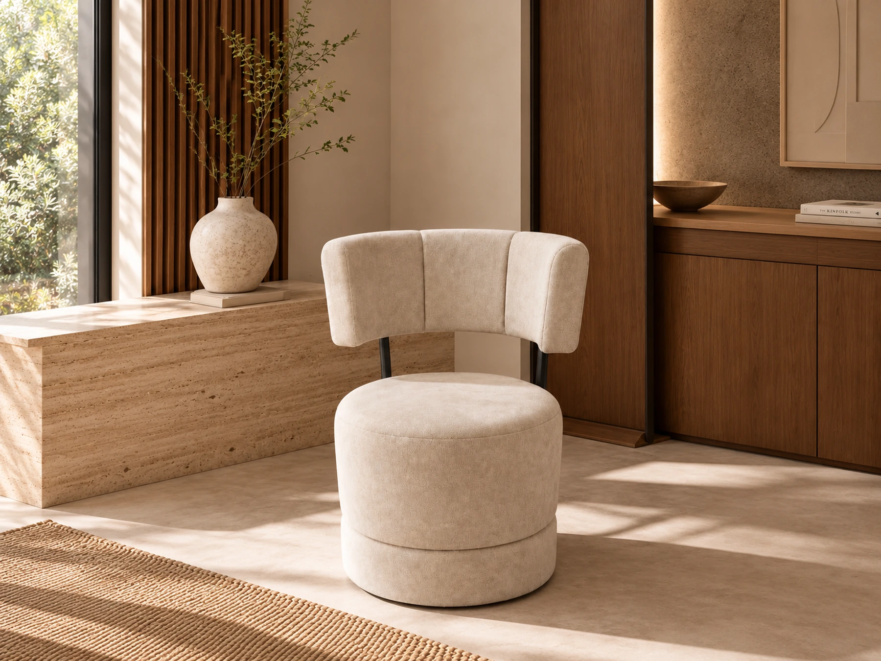 Ivory accent chair with a segmented curved back and rounded upholstered seat in a warm styled interior visualization.