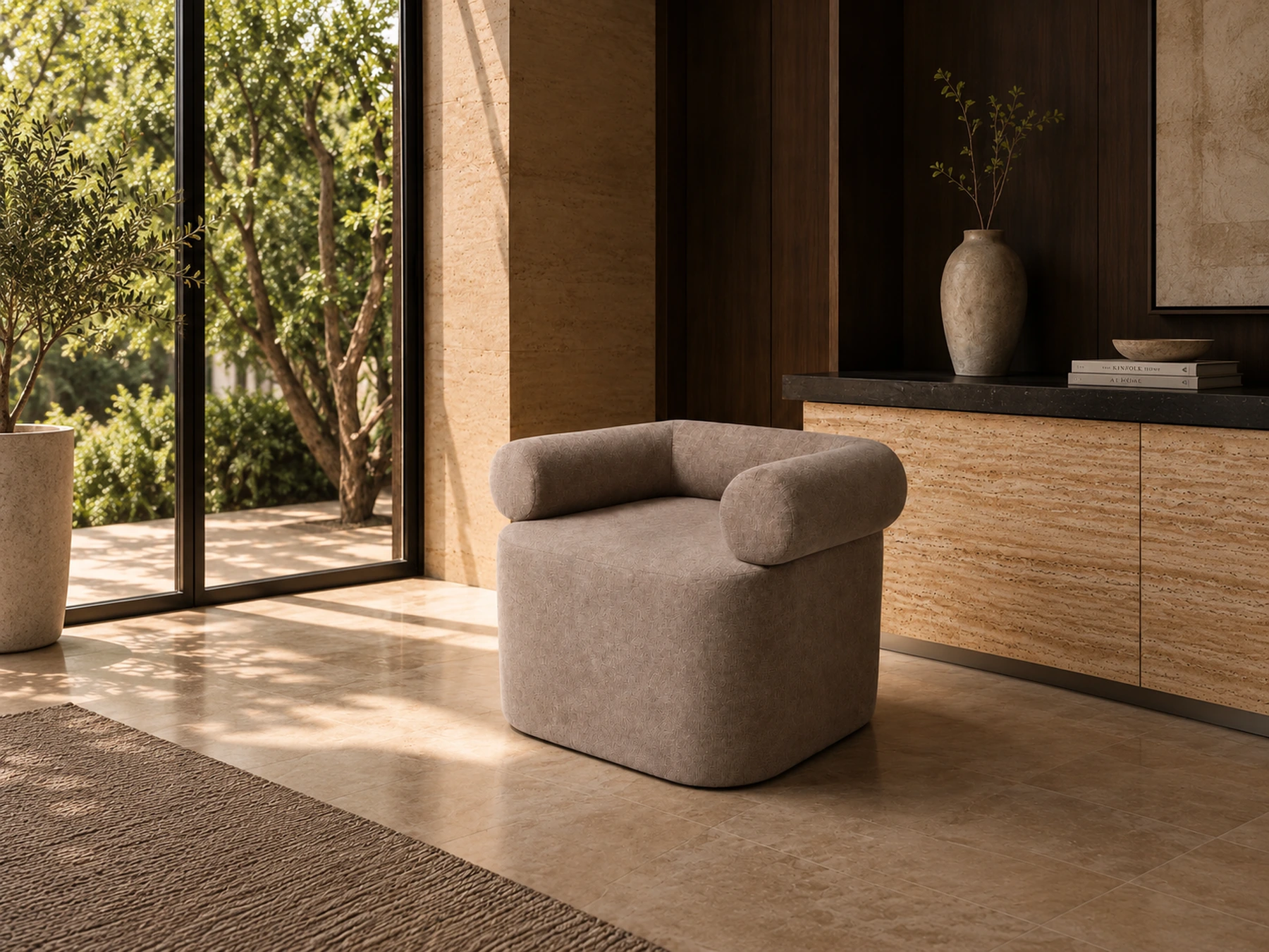 Upholstered accent chair with cylindrical arms and a tailored seat in a warm styled interior visualization.